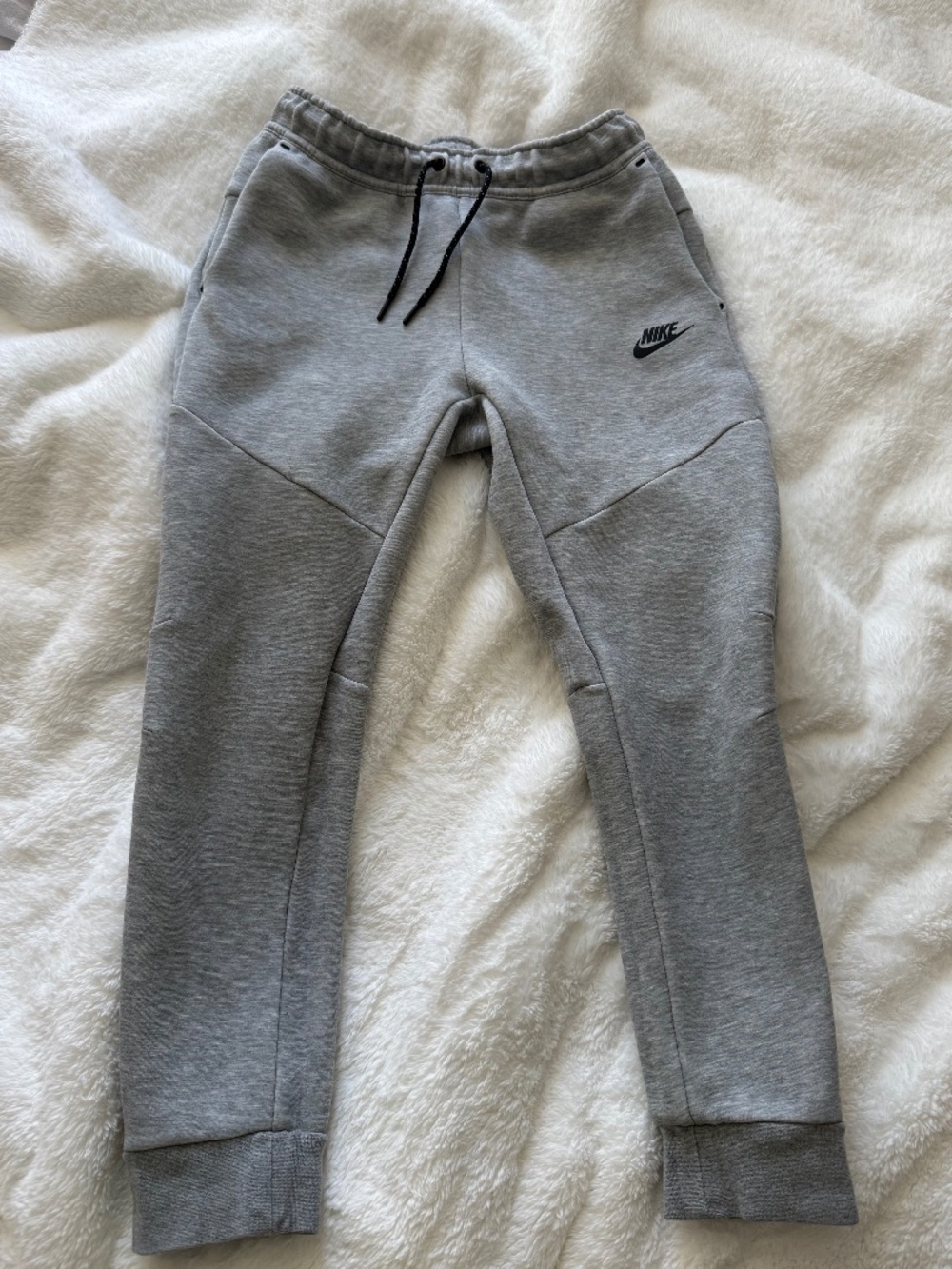 Gray Nike tech pants